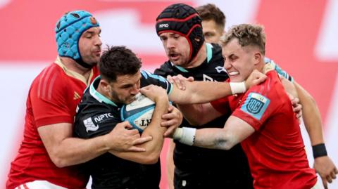 Munster's Tadhg Beirne and Craig Casey tackle Ospreys’ Owen Watkin