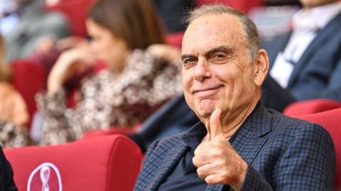 Avram Grant giving a thumbs up whilst watching football at the 2022 World Cup in Qatar
