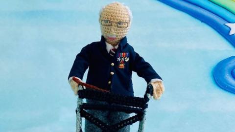 Knitted model of Captain Tom Moore