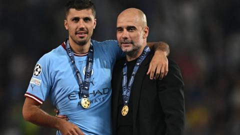 Rodri and Pep Guardiola celebrate after Manchester City's Champions League win