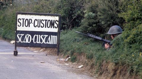 An Irish soldier guards at customs post on the southern side of the border at Swanlinbar, County Cavan, in the mid 1970s