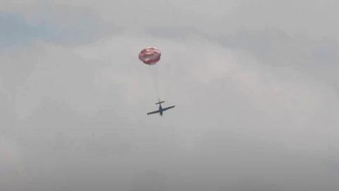 Plane with parachute