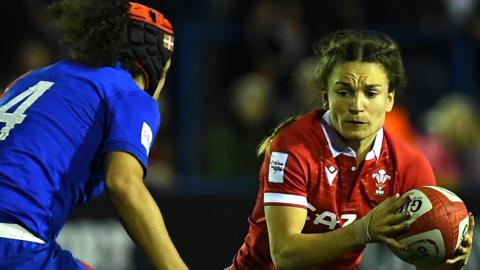 Wales' Jasmine Joyce tries to evade Celine Ferer of France in the Women's Six Nations