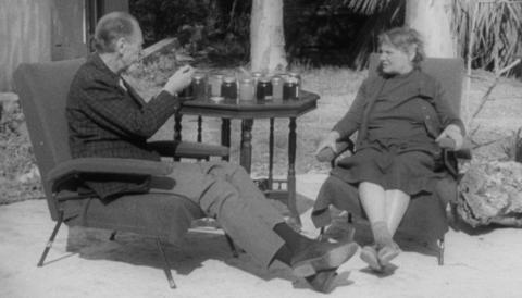 Fyfe Robertson tasting honey with Olive Brittan