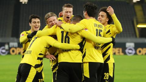 Borussia Dortmund's players celebrate scoring against Wolfsburg in the Bundesliga