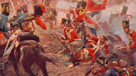 A painting shows the Battle of Quatre Bras in Belgium on 16 June 1815. Soldiers from opposing armies fight across an open battlefield with infantry, cavalry and military formations visible amid smoke from the conflict. The image is from The Century Edition of Cassell's History of England, published c.1900