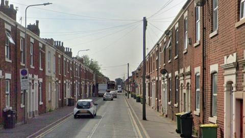 Google Streetview image of Plungington Road, a street in Preston with red-brick terraced houses on either side of a long straight road.