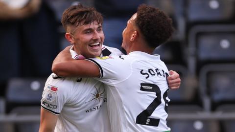 Luke Cundle of Swansea City celebrates scoring the second goal with Matty Sorinola of Swansea City