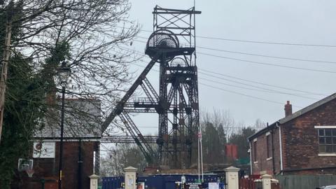 Wrought iron lattice headgear and the engine house in the Lancashire Mining Museum