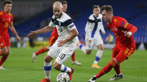 Teemu Pukki of Finland holds off Joe Rodon of Wales during their 2020 Nations League game