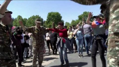 Opposition supporters dance in the streets of Armenia's capital Yerevan