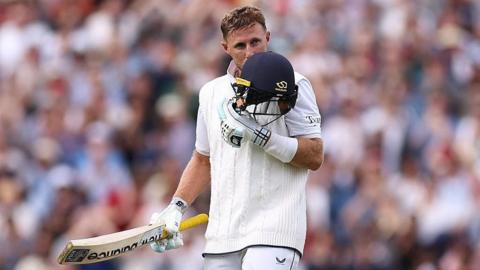 England batter Joe Root kisses his helmet after reaching a century v India