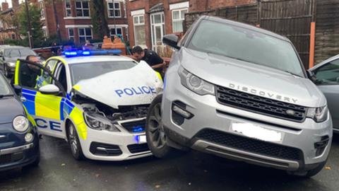 Police car damaged by Land Rover