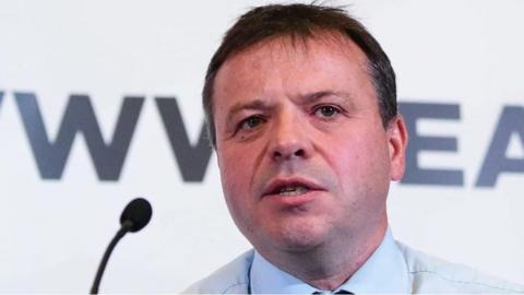 A close associate of the Brexit donor Arron Banks has raised questions about whether he had business contacts with Russia.