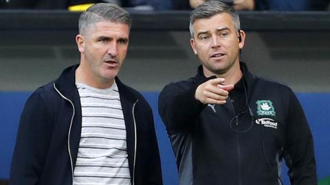 Ryan Lowe (left) and Steven Schumacher on the touchline while at Plymouth Argyle