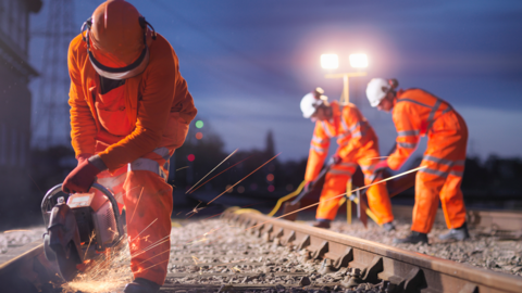 People working on rail tracks