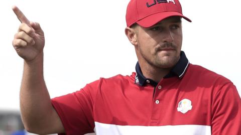 Bryson DeChambeau celebrates eagling the first hole in the singles at the Ryder Cup