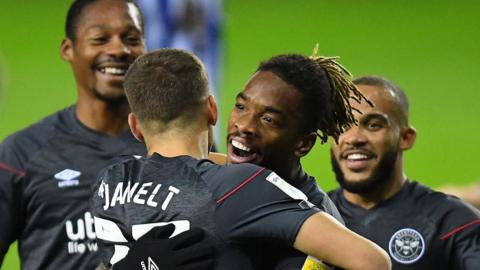 Brentford players celebrate Ivan Toney's second goal of the day