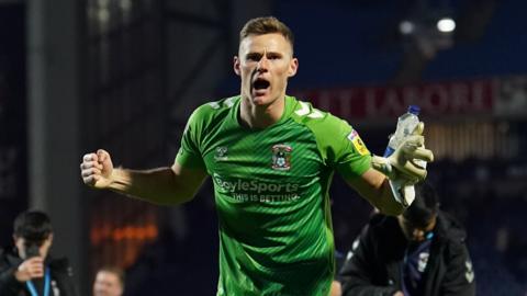 Coventry keeper Ben Wilson celebrates scoring at Blackburn