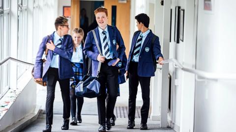 Teenagers in school blazers