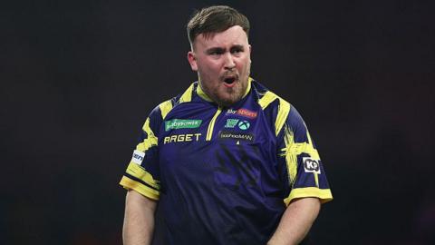 Luke Littler celebrates