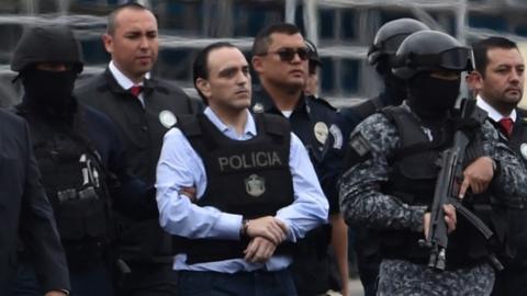 The former governor of the Mexican state of Quintana Roo, Roberto Borge (C) is escorted by the police during his extradition to Mexico, at Panama City"s Tocumen international airport on January 4, 2018