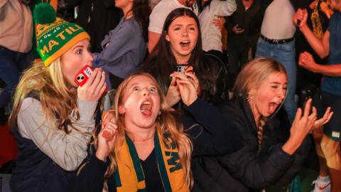 Australia fans celebrate the win over France