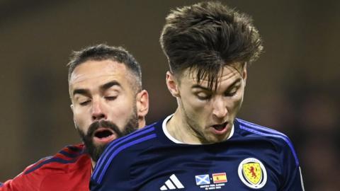 Spain's Dani Carvajal and Scotland's Kieran Tierney in March