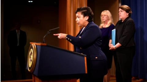 US Attorney General Loretta E Lynch, flanked by US Attorney Eileen M Decker of the Central District of California (centre) and Assistant Attorney General Leslie R Caldwell (right) as she announces the filing of civil forfeiture complaints in Washington, 20 July 2016.