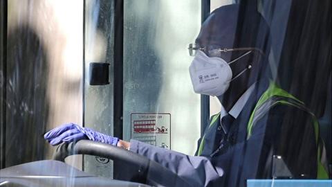 Bus driver with face mask