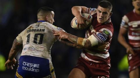 Brad O'Neill carries the ball for Wigan against Warrington