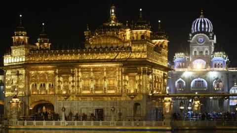 Sikh devotees pay respect at the Golden Temple in Amritsar on December 18, 2021