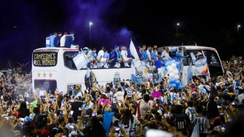 Fans greet the Argentina bus