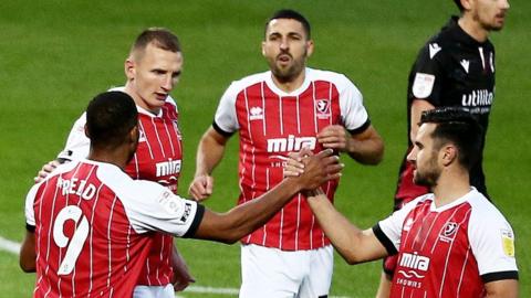 Cheltenham celebrate Reuben Reid's goal