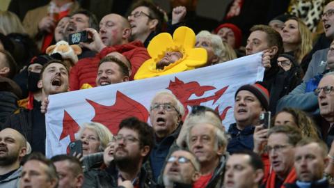 CARDIFF, WALES - FEBRUARY 12: A Welsh fan signs the Welsh national anthem during the Guinness Six Nations Round 2 match between Wales and Scotland at Principality Stadium on February 12, 2022 in Cardiff, Wales