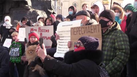 Protesters with placards gather in Vladivostok