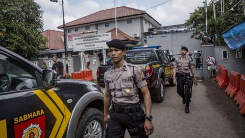 CILACAP, CENTRAL JAVA, INDONESIA - JULY 27: Indonesian police walk as guard at Wijayapura port, which is the entrance gate to Nusakambangan prison as Indonesia prepare for third round of drug executions on July 27, 2016