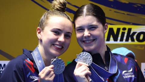 Britain's Andrea Spendolini-Sirieix and Lois Toulson with their world silver medals after finishing second in the women's 10m synchronised in Fukuoka, Japan