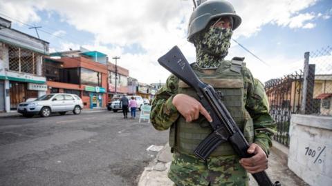 Ecuadorian soldiers stand in a checkpoint to control for weapons and drugs in Quito, Ecuador, 26 July 2023.