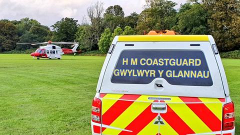 HM Coastguard helicopter and 4x4 vehicle
