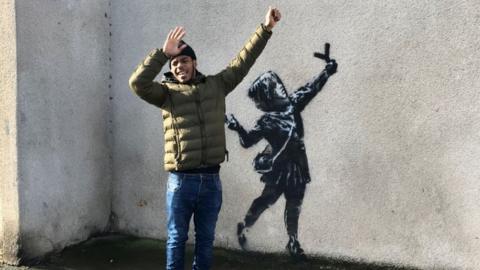 Banksy fan Remel Sewell believes the message may be to celebrate love and peace