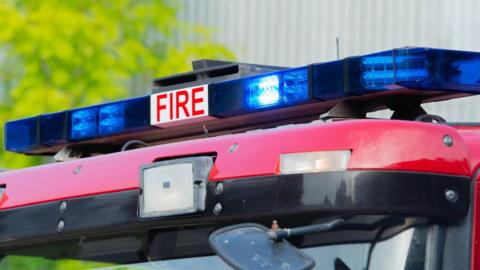 A close up of the lights on top of a fire engine.