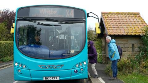 Passengers boarding the X5 Whitby bus.