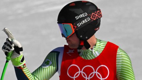 Jack Gower signals his contentment with his performance in the men's combined skiing event in Beijing on Thursday