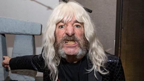 Actor Harry Shearer appears in character as bassist Derek Smalls of Spinal Tap