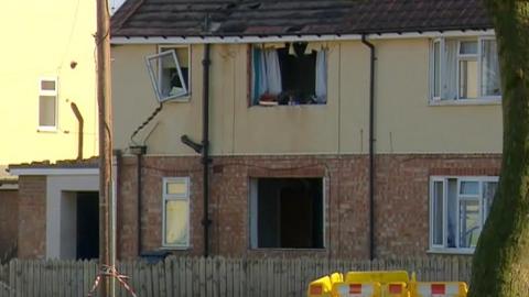 The blast-damaged house