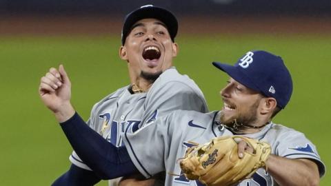 Willy Adames and Brandon Lowe celebrate