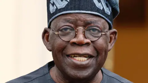 Nigerian President Bola Ahmed Tinubu arrives for the Compact with Africa (CwA) conference at the Bellevue Palace in Berlin, Germany, 20 November 2023.