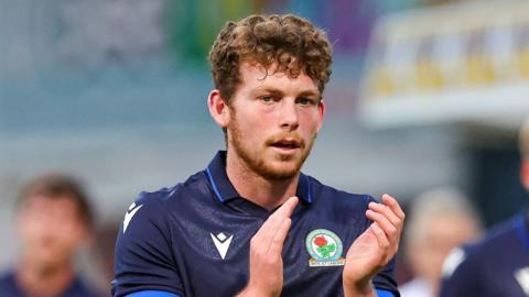 Dan Pike applauds during an appearance for Blackburn Rovers