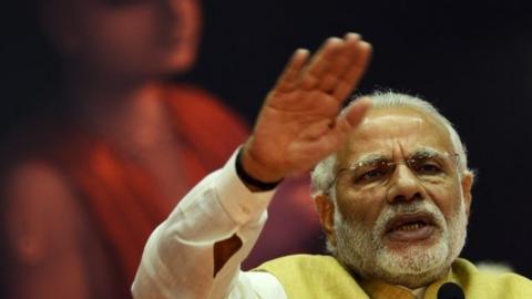 Indian Prime Minister Narendra Modi speaks during the centenary celebration of missionary organisation the Gaudiya Math and Mission at the Netaji Indoor Stadium in Kolkata on February 21, 2016I